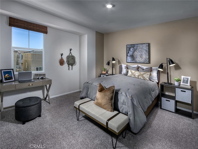 carpeted bedroom featuring baseboards