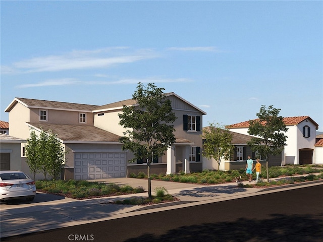 view of front facade with stucco siding, a garage, and driveway