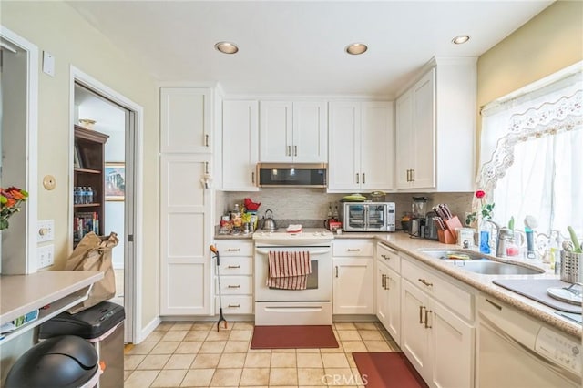 16511 Caminito Vecinos Unit 59, San Diego, CA 92128 - kitchen featuring white appliances, white cabinetry, a sink, decorative backsplash, and recessed lighting