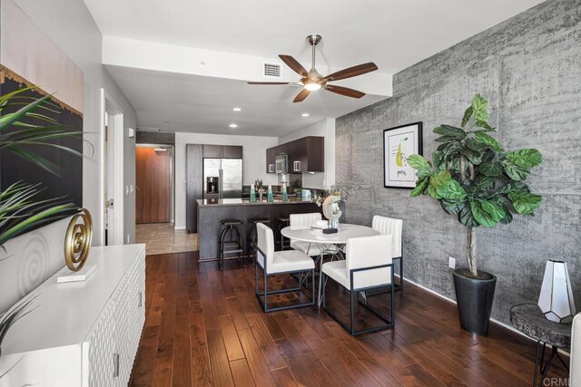 800 The Mark Ln Unit 602, San Diego, CA 92101 - dining area with ceiling fan, dark wood finished floors, recessed lighting, and an accent wall