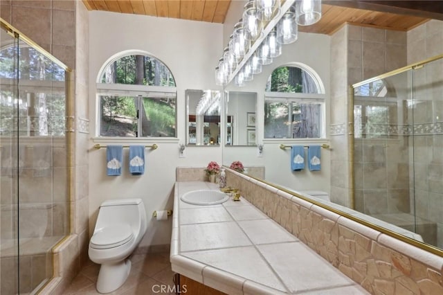 24571 Albrun Dr, Crestline, CA 92325 - full bath with wood ceiling, tile patterned flooring, toilet, a stall shower, and vanity