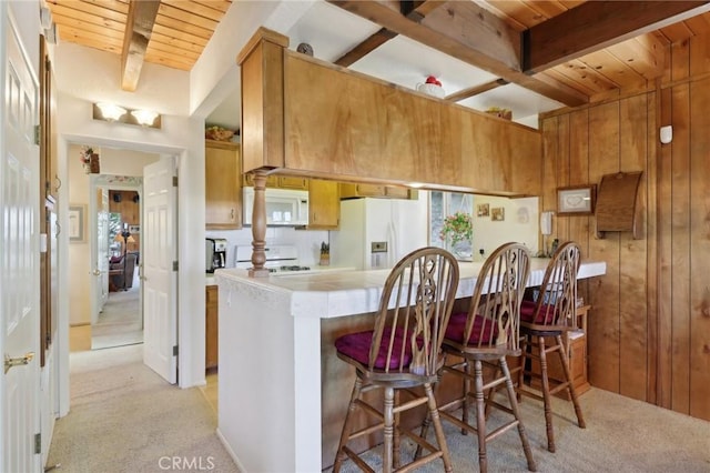 24571 Albrun Dr, Crestline, CA 92325 - kitchen featuring white appliances, light carpet, light countertops, wood ceiling with exposed beams, and wooden walls