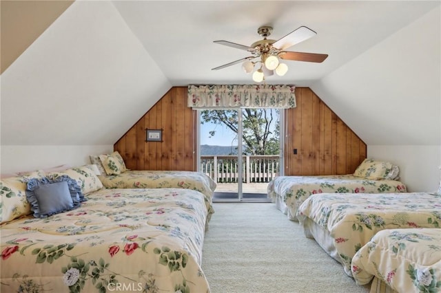 24571 Albrun Dr, Crestline, CA 92325 - bedroom featuring wood walls, access to exterior, lofted ceiling, carpet, and a ceiling fan