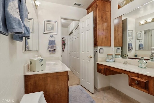 24571 Albrun Dr, Crestline, CA 92325 - bathroom with tile patterned flooring, toilet, and vanity