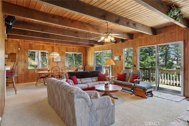 24571 Albrun Dr, Crestline, CA 92325 - living room with carpet, wooden walls, wooden ceiling with exposed beams, and ceiling fan