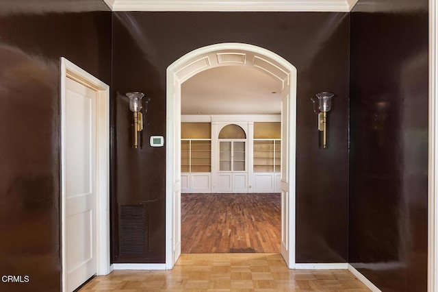 525 Laguna Rd, Pasadena, CA 91105 - corridor featuring arched walkways, wood finished floors, and baseboards