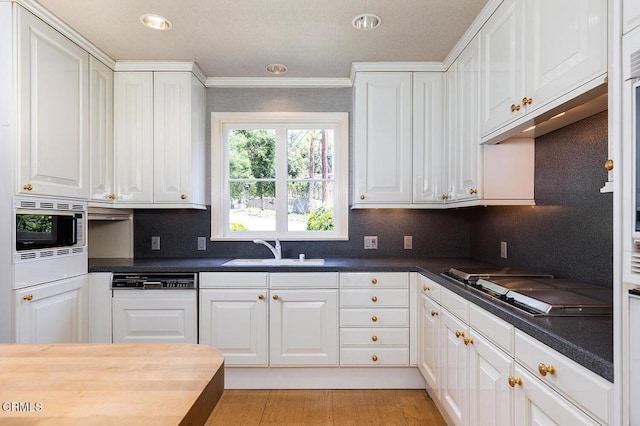 525 Laguna Rd, Pasadena, CA 91105 - kitchen featuring dishwasher, a sink, white cabinets, stainless steel microwave, and recessed lighting