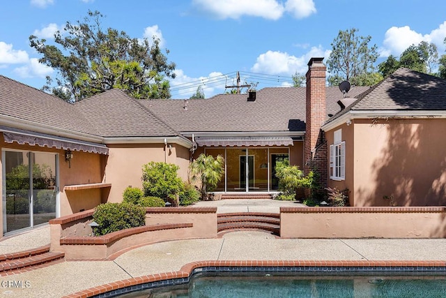 525 Laguna Rd, Pasadena, CA 91105 - rear view of property featuring a patio, an outdoor pool, stucco siding, and roof with shingles