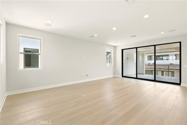 208 Stage, Irvine, CA 92618 - unfurnished room with healthy amount of natural light, light wood-style floors, and recessed lighting