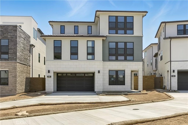 208 Stage, Irvine, CA 92618 - view of front of home featuring driveway, an attached garage, and stucco siding