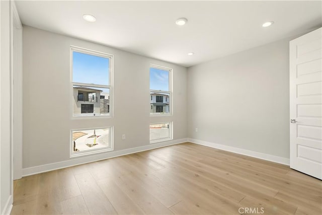 208 Stage, Irvine, CA 92618 - unfurnished room featuring light wood-style flooring and recessed lighting