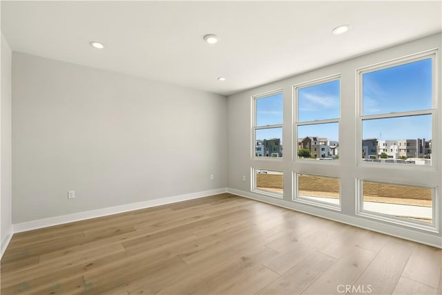 208 Stage, Irvine, CA 92618 - empty room featuring wood finished floors and recessed lighting