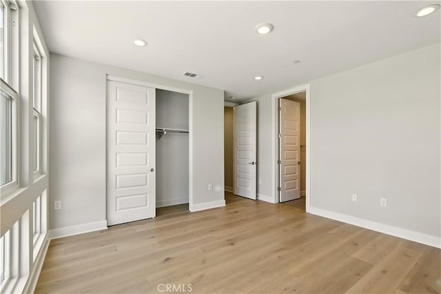 208 Stage, Irvine, CA 92618 - unfurnished bedroom with recessed lighting, light wood finished floors, and a closet