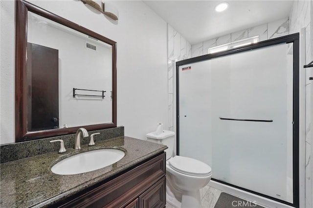 full bath featuring toilet, a stall shower, marble finish floors, and vanity