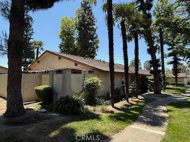 1453 W 7th St, Upland, CA 91786 - view of home's exterior featuring fence