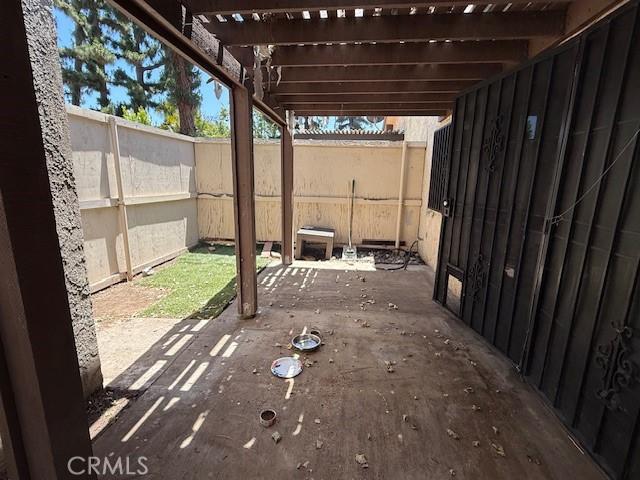 1453 W 7th St, Upland, CA 91786 - view of patio with fence, a pergola, and a gate