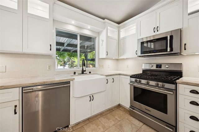 8825 Old Santa Rosa Rd, Atascadero, CA 93422 - kitchen with stainless steel appliances, a sink, light tile patterned flooring, and white cabinetry
