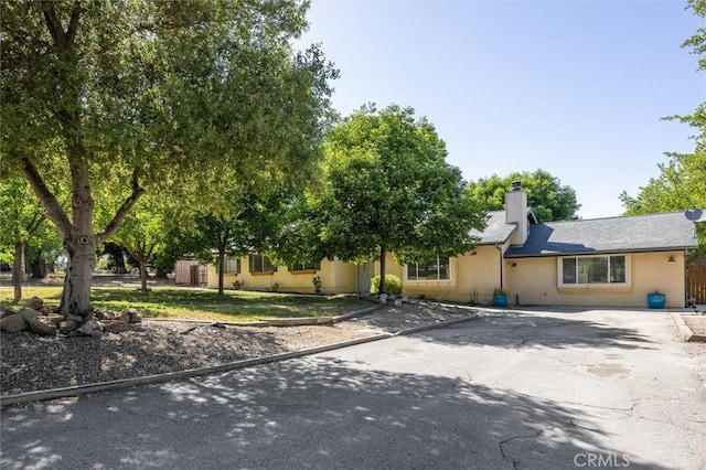8825 Old Santa Rosa Rd, Atascadero, CA 93422 - view of front of home with a chimney and asphalt driveway