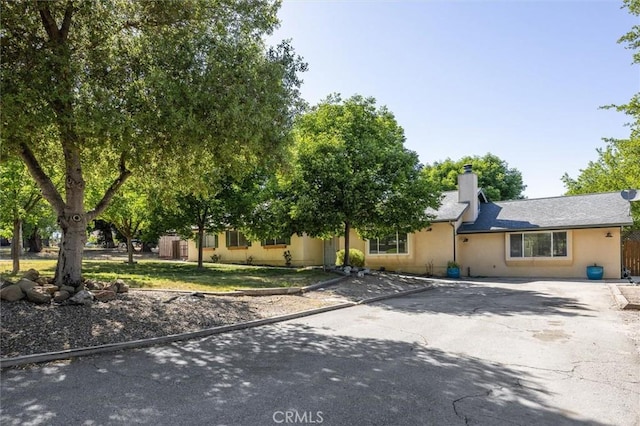8825 Old Santa Rosa Rd, Atascadero, CA 93422 - view of front facade with a chimney and asphalt driveway