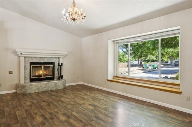 8825 Old Santa Rosa Rd, Atascadero, CA 93422 - unfurnished living room featuring wood finished floors, a chandelier, lofted ceiling, baseboards, and a tiled fireplace