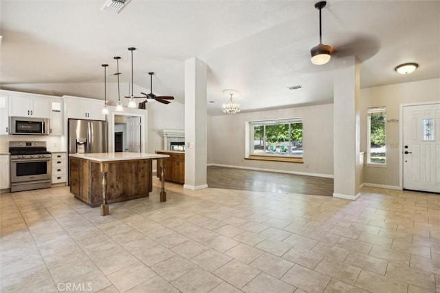 8825 Old Santa Rosa Rd, Atascadero, CA 93422 - kitchen with appliances with stainless steel finishes, a ceiling fan, open floor plan, lofted ceiling, and light countertops
