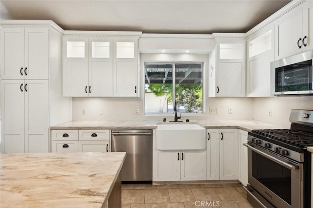 8825 Old Santa Rosa Rd, Atascadero, CA 93422 - kitchen with appliances with stainless steel finishes, a sink, white cabinetry, and glass insert cabinets