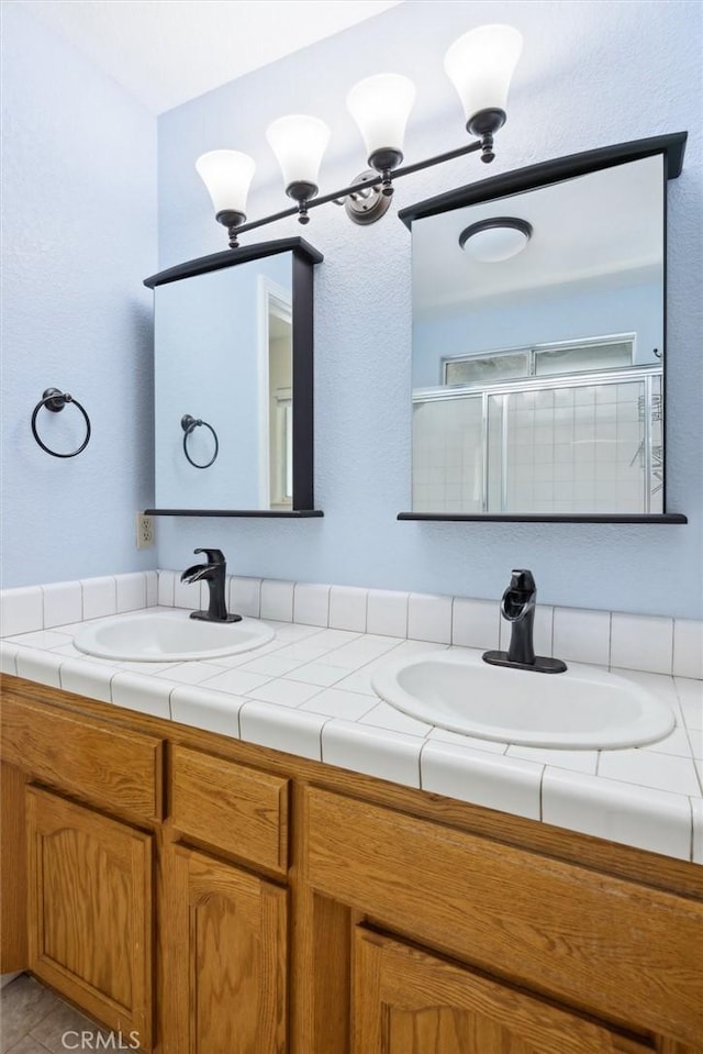 8825 Old Santa Rosa Rd, Atascadero, CA 93422 - bathroom with double vanity and a shower with shower door