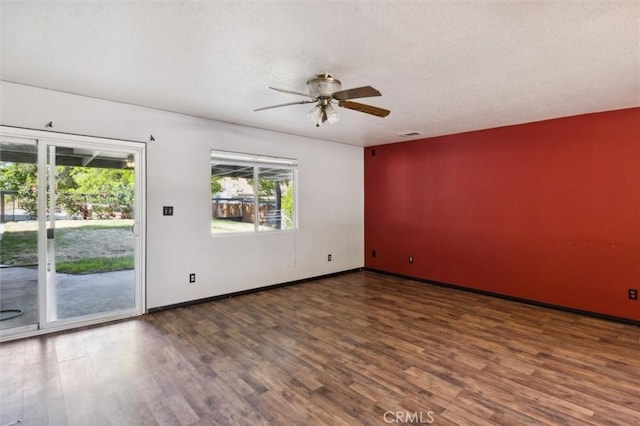 8825 Old Santa Rosa Rd, Atascadero, CA 93422 - spare room with wood finished floors, a ceiling fan, and baseboards