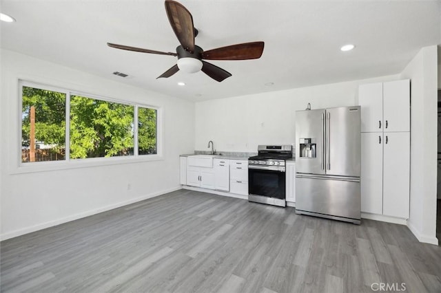 8825 Old Santa Rosa Rd, Atascadero, CA 93422 - kitchen featuring stainless steel appliances, a sink, wood finished floors, a ceiling fan, and light countertops