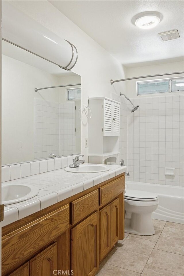 8825 Old Santa Rosa Rd, Atascadero, CA 93422 - full bath with double vanity, shower / bath combination, toilet, and tile patterned flooring