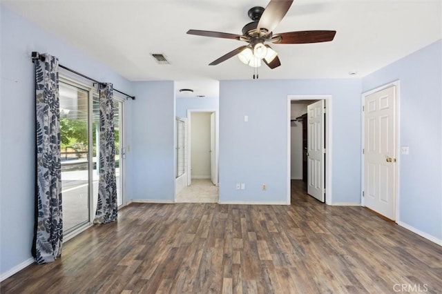 8825 Old Santa Rosa Rd, Atascadero, CA 93422 - unfurnished bedroom featuring wood finished floors, baseboards, access to outside, a walk in closet, and a ceiling fan