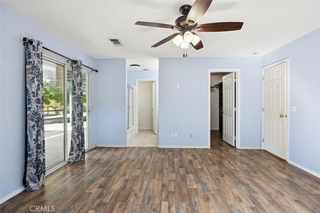 8825 Old Santa Rosa Rd, Atascadero, CA 93422 - unfurnished bedroom featuring wood finished floors, access to outside, a walk in closet, and ceiling fan
