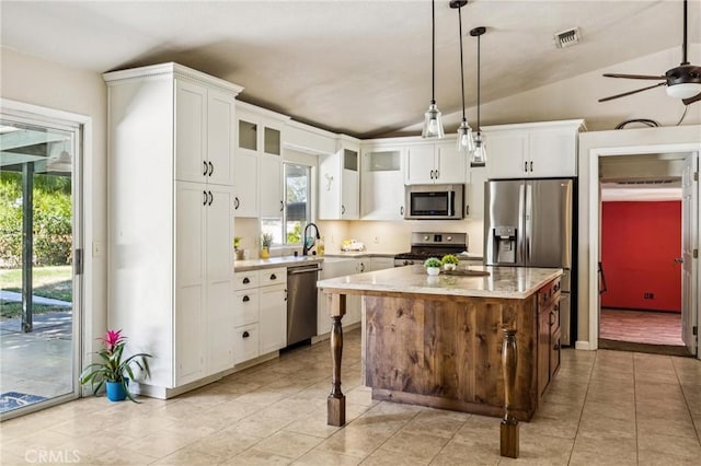 8825 Old Santa Rosa Rd, Atascadero, CA 93422 - kitchen featuring stainless steel appliances, lofted ceiling, plenty of natural light, white cabinets, and a ceiling fan