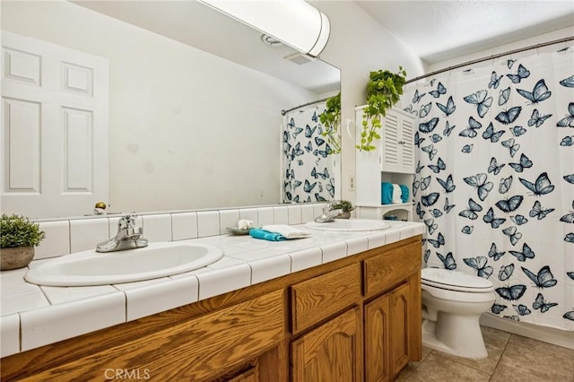 8825 Old Santa Rosa Rd, Atascadero, CA 93422 - full bathroom with double vanity, tile patterned floors, and a shower with shower curtain