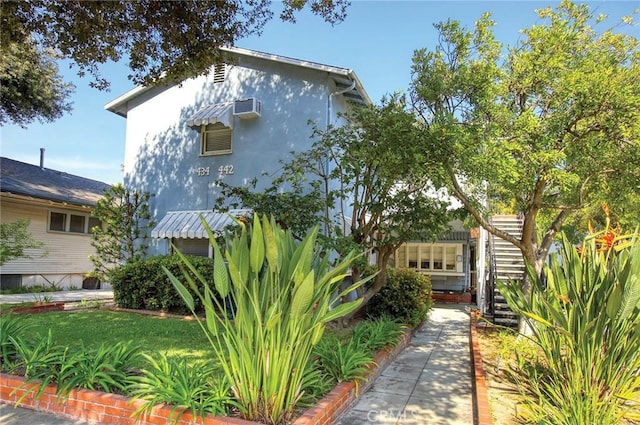 434 S Euclid Ave, Pasadena, CA 91101 - view of front of property with stucco siding and a wall mounted air conditioner