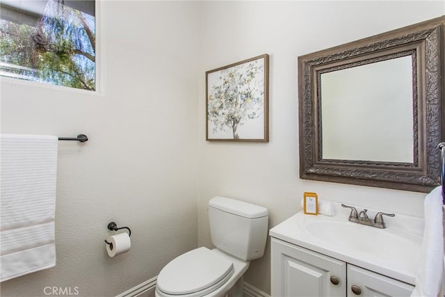 34879 Olive Tree Ln, Yucaipa, CA 92399 - bathroom featuring toilet, vanity, and baseboards