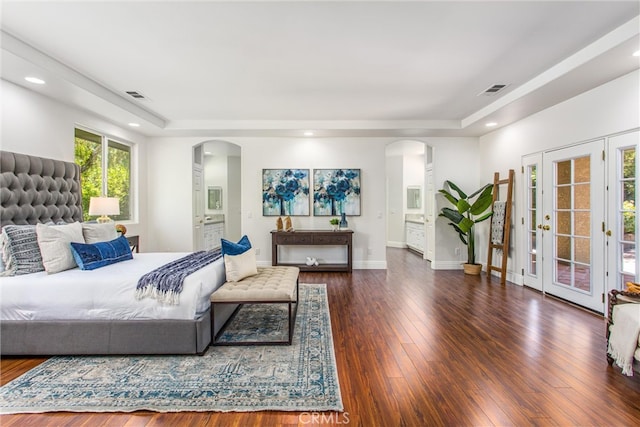 34879 Olive Tree Ln, Yucaipa, CA 92399 - bedroom with arched walkways, a tray ceiling, access to outside, and recessed lighting