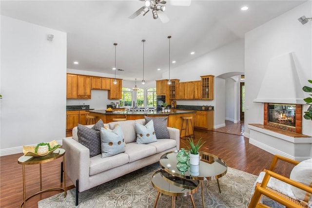 34879 Olive Tree Ln, Yucaipa, CA 92399 - living area with a ceiling fan, baseboards, arched walkways, dark wood-type flooring, and recessed lighting