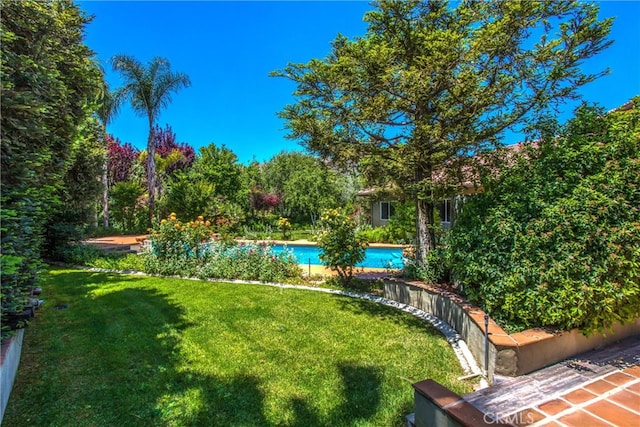 34879 Olive Tree Ln, Yucaipa, CA 92399 - view of grassy yard with an outdoor pool