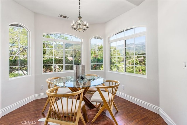 34879 Olive Tree Ln, Yucaipa, CA 92399 - dining area with a chandelier, plenty of natural light, baseboards, and dark wood finished floors