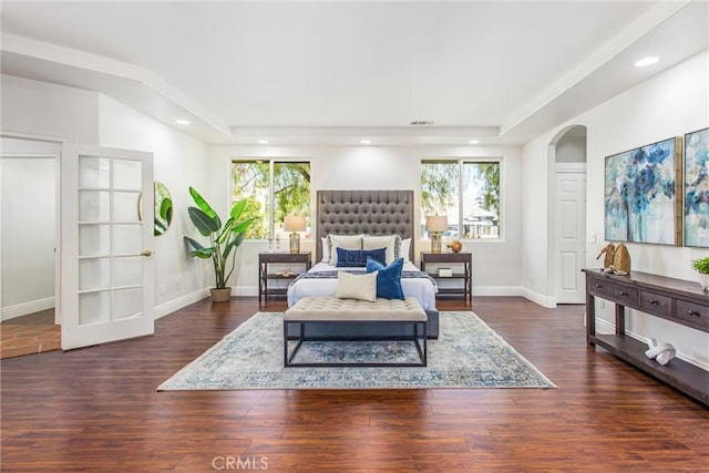 34879 Olive Tree Ln, Yucaipa, CA 92399 - bedroom with multiple windows, dark wood finished floors, arched walkways, baseboards, and recessed lighting