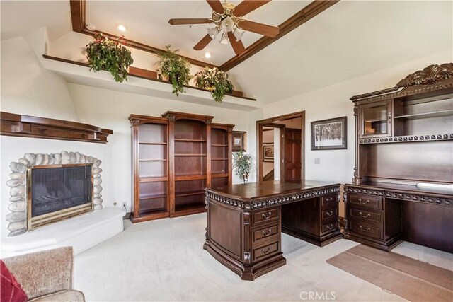 7008 Hawarden Dr, Riverside, CA 92506 - unfurnished office with a glass covered fireplace, ceiling fan, vaulted ceiling, built in desk, and light carpet