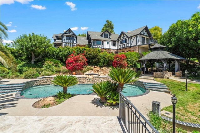 7008 Hawarden Dr, Riverside, CA 92506 - outdoor pool with a gazebo and a patio