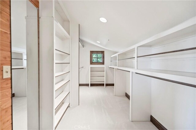 7008 Hawarden Dr, Riverside, CA 92506 - walk in closet with vaulted ceiling and light carpet
