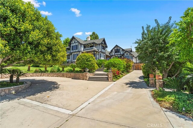 7008 Hawarden Dr, Riverside, CA 92506 - tudor-style house with a gate