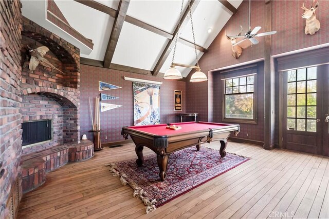 7008 Hawarden Dr, Riverside, CA 92506 - rec room featuring high vaulted ceiling, billiards, beam ceiling, hardwood / wood-style flooring, and a brick fireplace