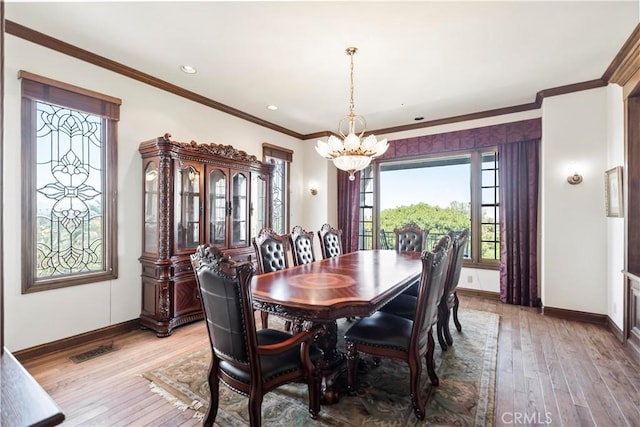 7008 Hawarden Dr, Riverside, CA 92506 - dining room featuring a chandelier, baseboards, light wood-style flooring, crown molding, and recessed lighting