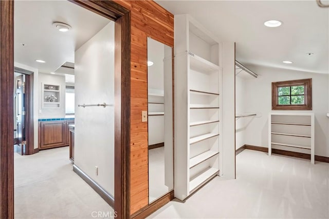 7008 Hawarden Dr, Riverside, CA 92506 - spacious closet featuring light carpet and vaulted ceiling