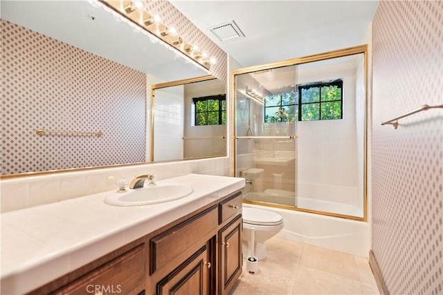 7008 Hawarden Dr, Riverside, CA 92506 - full bathroom featuring wallpapered walls, plenty of natural light, toilet, tile patterned flooring, and vanity