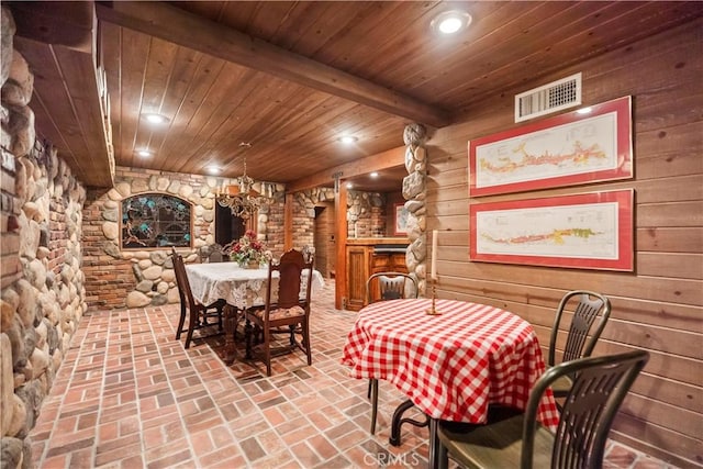 7008 Hawarden Dr, Riverside, CA 92506 - dining room featuring wood ceiling, brick floors, wood walls, recessed lighting, and beamed ceiling